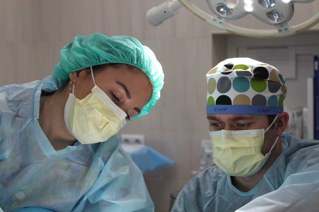 surgeons performing surgery in hospital